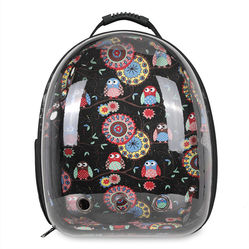 Introducing the Clear Cat and Dog Carrier Backpack—a black backpack with a transparent front panel, decorated with a vibrant pattern of owls and flowers. Designed as a breathable pet backpack, it features ventilation holes for your pet’s comfort, making it ideal for carrying small pets on the go.
