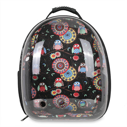 Introducing the Clear Cat and Dog Carrier Backpack—a black backpack with a transparent front panel, decorated with a vibrant pattern of owls and flowers. Designed as a breathable pet backpack, it features ventilation holes for your pet’s comfort, making it ideal for carrying small pets on the go.