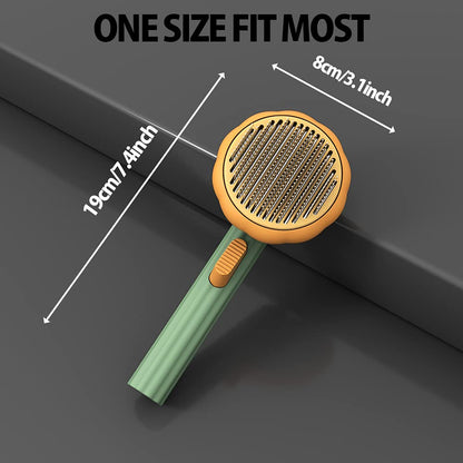 Pumpkin Design Needle Comb for Dog and Cat Grooming with a green handle and gold head, shown on a dark surface. Text above reads ONE SIZE FIT MOST. Ideal as a pumpkin pet brush or slicker brush, this cat and dog needle comb measures 19cm (7.4 inches) in length and 8cm (3.1 inches) in width.