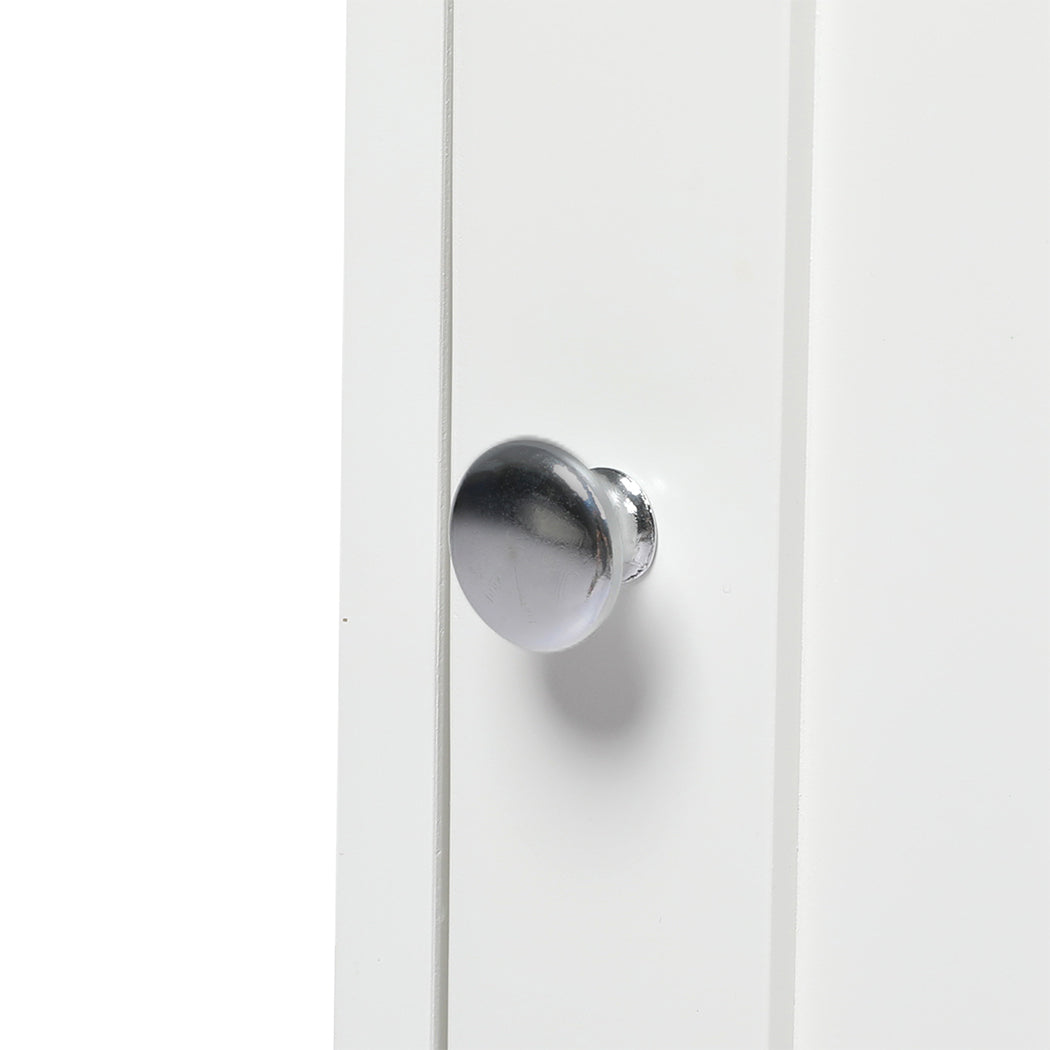 Close-up of the PaWz Cat Litter Box Mat Fully Enclosed, featuring its shiny metallic round knob attached to a white front panel. The background is minimal and plain.